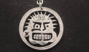 Custom carved Mexican peso coin souvenir by Alberto the Coin Guy in Cancun
