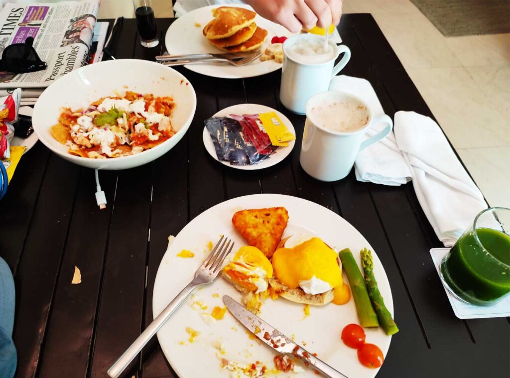 Room service at El Dorado Seaside Suites we had pancakes, eggs benedict, chicken chilaquiles, coffee and juice.